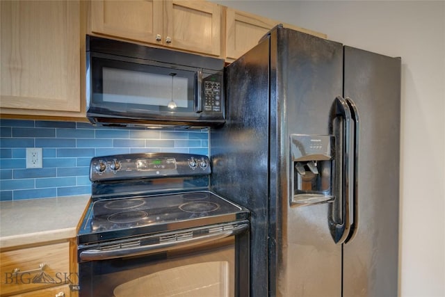 kitchen featuring black appliances, light brown cabinets, and tasteful backsplash