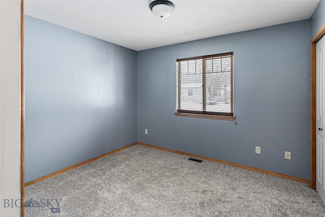 spare room with carpet flooring