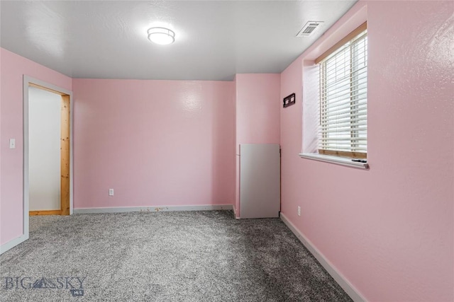 empty room with carpet flooring