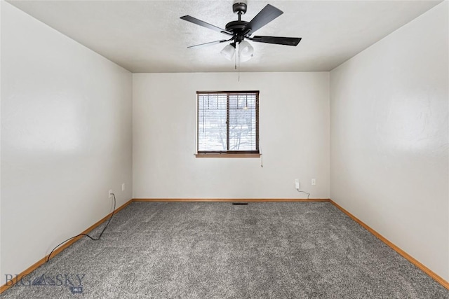 carpeted empty room featuring ceiling fan