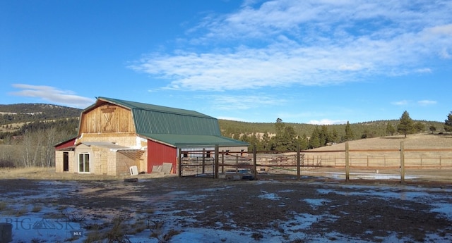 exterior space with a rural view and an outdoor structure