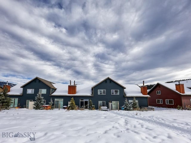 view of snow covered property