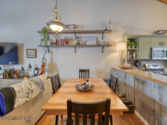 dining area featuring light wood-type flooring