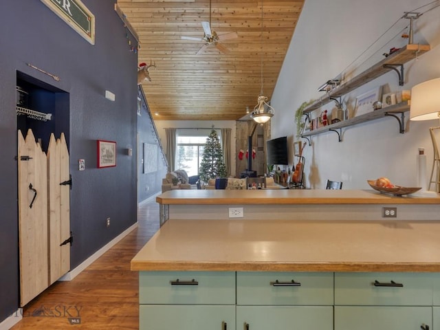 kitchen with lofted ceiling, wooden ceiling, dark wood-type flooring, ceiling fan, and decorative light fixtures