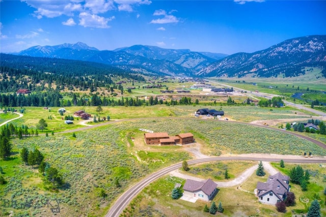 drone / aerial view featuring a mountain view and a rural view