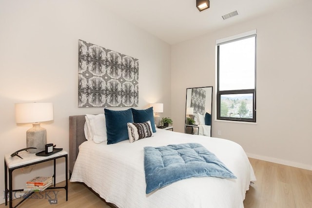 bedroom featuring hardwood / wood-style floors