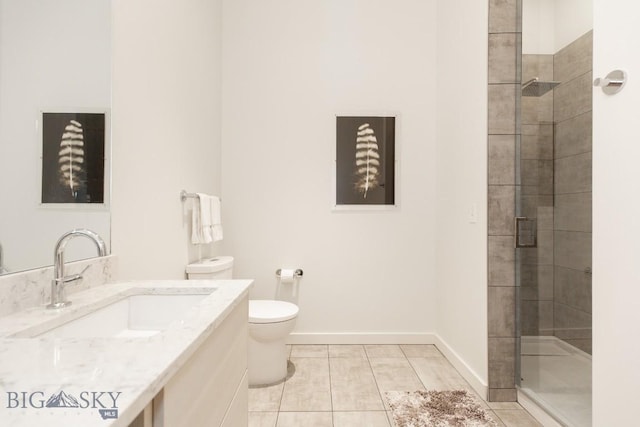 515 W Aspen St Unit 317, Bozeman, MT 59715 - bathroom featuring toilet, vanity, tile patterned flooring, and a tile shower