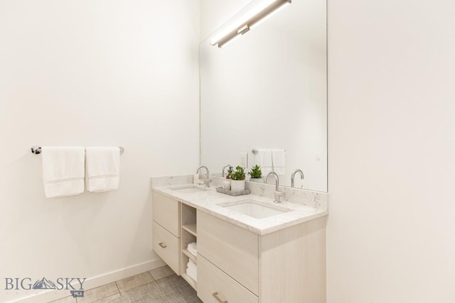 bathroom with tile patterned flooring and vanity