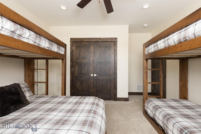 carpeted bedroom with ceiling fan