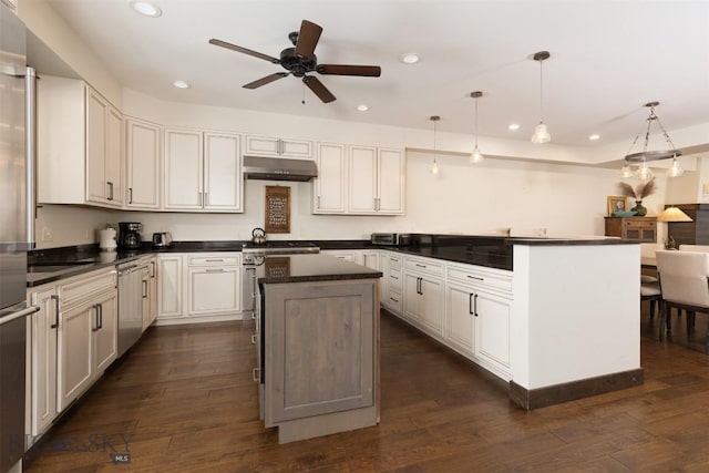 kitchen with pendant lighting, white cabinetry, a kitchen island, and ceiling fan