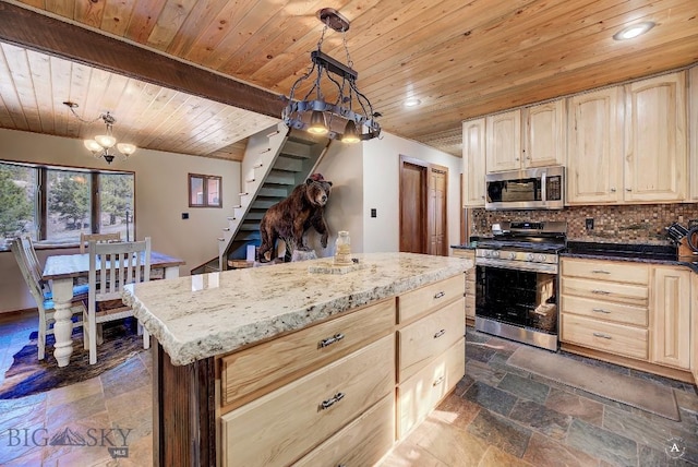 kitchen with stainless steel appliances, beam ceiling, wooden ceiling, a kitchen island, and hanging light fixtures