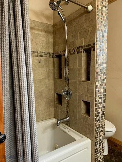 bathroom featuring shower / bath combo and toilet