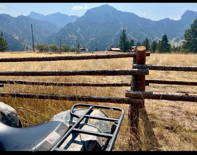 view of yard featuring a mountain view and a rural view