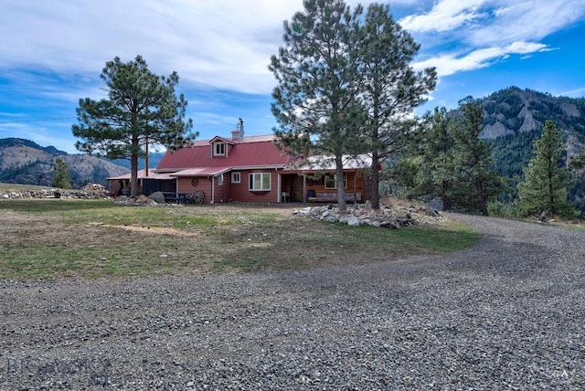 single story home featuring a mountain view