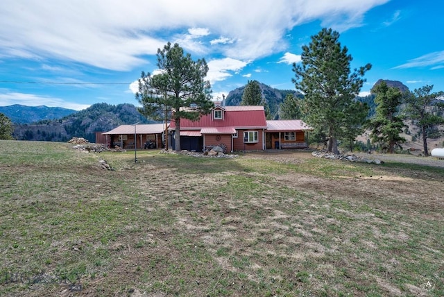 exterior space featuring a mountain view