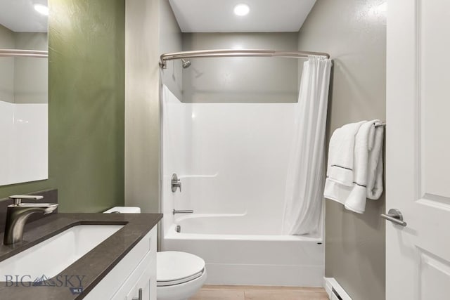 full bathroom with a baseboard radiator, toilet, shower / tub combo, wood finished floors, and vanity