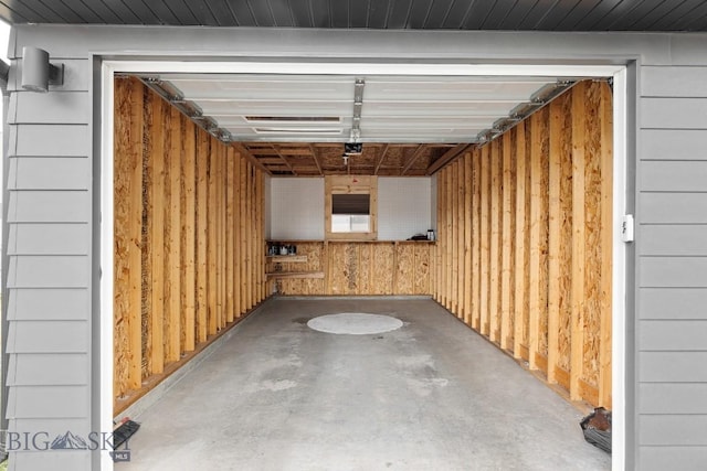 garage featuring wooden walls