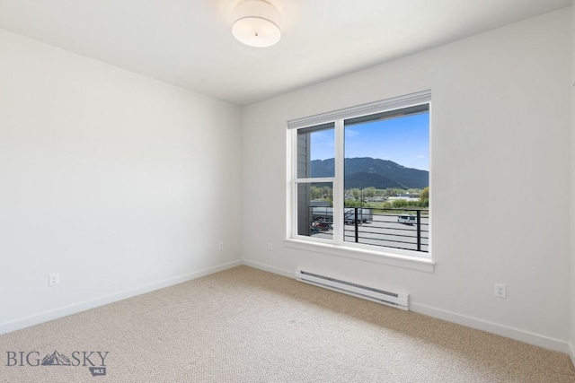 2221F Willow Unit 104, Livingston, MT 59047 - carpeted spare room with a baseboard radiator, baseboards, and a mountain view