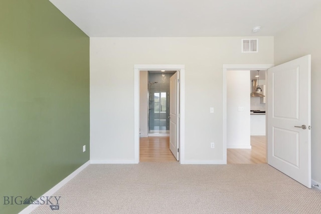2221F Willow Unit 104, Livingston, MT 59047 - unfurnished bedroom with light colored carpet and baseboards