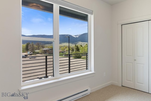 2221F Willow Unit 104, Livingston, MT 59047 - carpeted spare room with a mountain view and baseboard heating