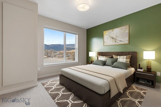 2221F Willow Unit 104, Livingston, MT 59047 - bedroom with carpet floors, baseboards, and a mountain view