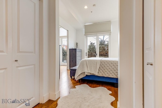 bedroom with hardwood / wood-style flooring