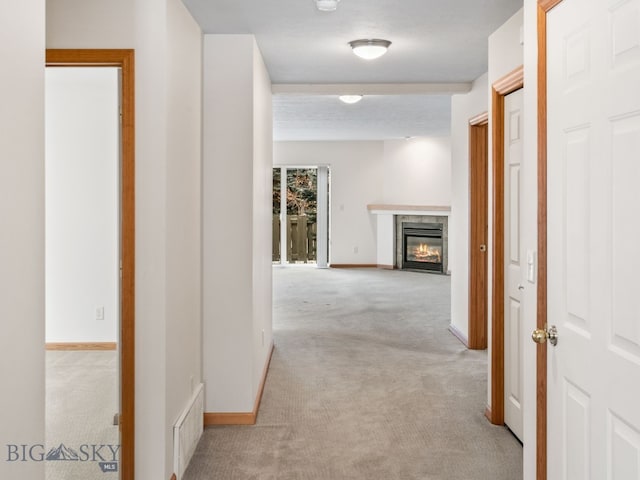 hallway featuring light carpet