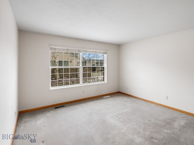 empty room featuring carpet flooring