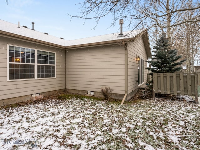 view of snow covered property