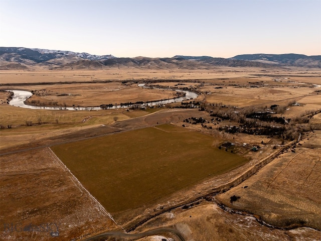 birds eye view of property with a rural view and a mountain view