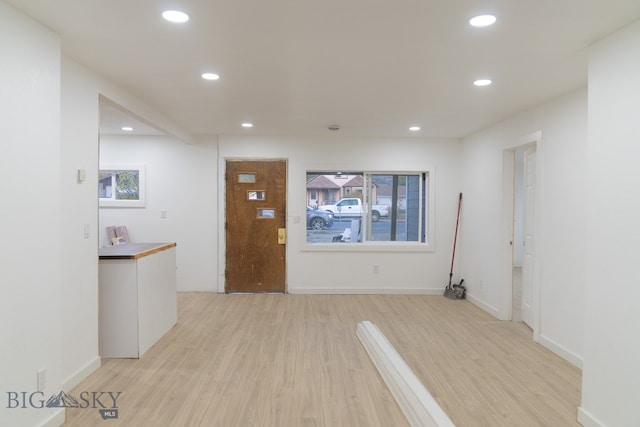 hall with light wood-type flooring