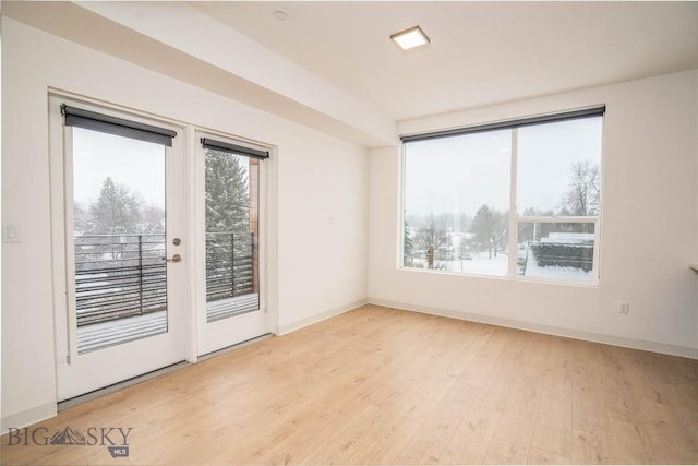 spare room with light hardwood / wood-style flooring