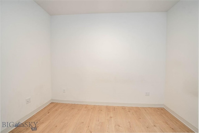 unfurnished room with light hardwood / wood-style floors