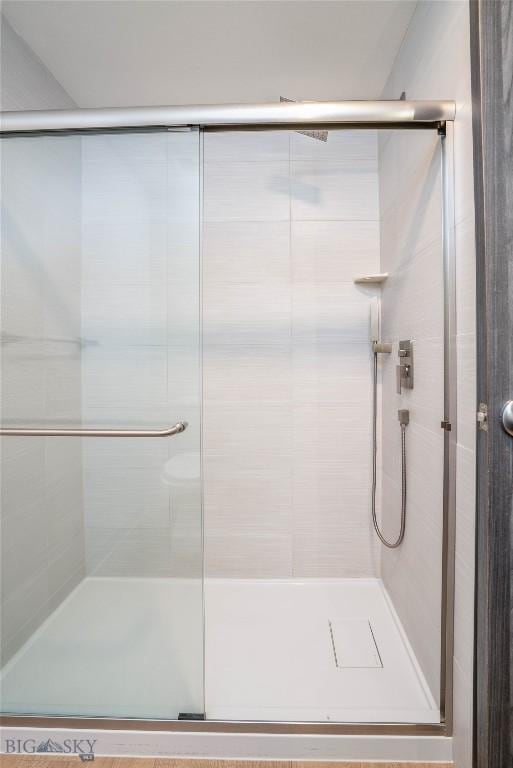 bathroom featuring an enclosed shower