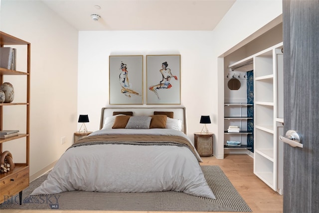 bedroom featuring light wood-type flooring