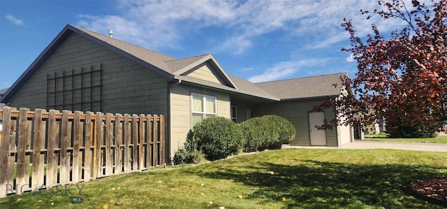 view of property exterior with a yard