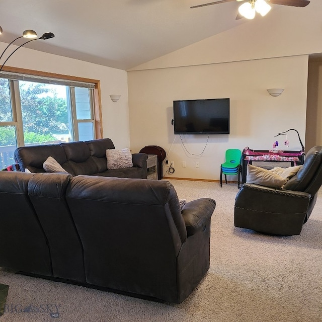 carpeted living room with ceiling fan and lofted ceiling