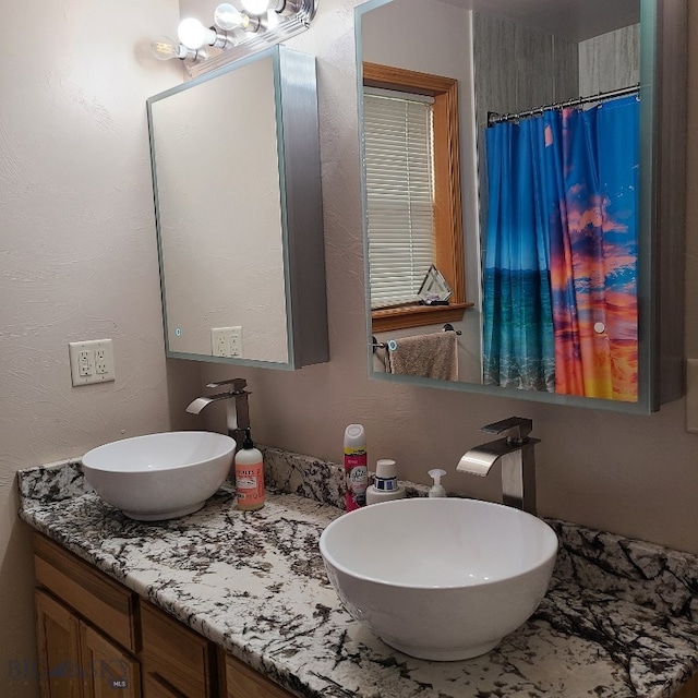 bathroom featuring vanity and walk in shower