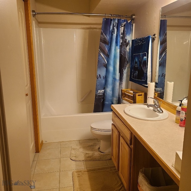 full bathroom featuring tile patterned floors, vanity, toilet, and shower / bath combo with shower curtain