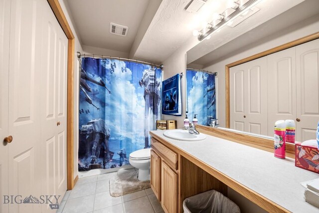 1311 Cruiser Ln, Belgrade, MT 59714 - bathroom with tile patterned floors, vanity, and curtained shower