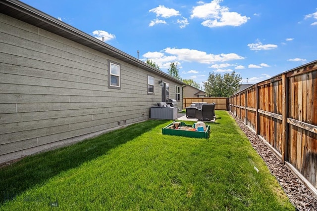 1311 Cruiser Ln, Belgrade, MT 59714 - fenced backyard featuring an outdoor living space and a patio