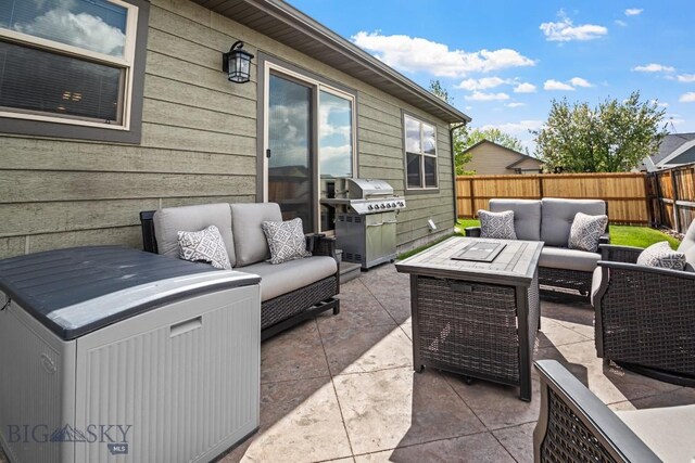 1311 Cruiser Ln, Belgrade, MT 59714 - fenced backyard featuring an outdoor living space and a patio