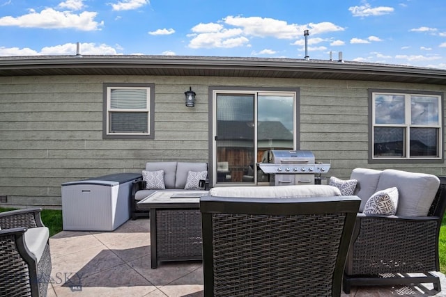 1311 Cruiser Ln, Belgrade, MT 59714 - view of patio / terrace with a grill and an outdoor hangout area