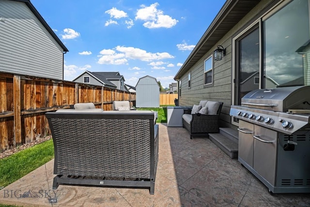 1311 Cruiser Ln, Belgrade, MT 59714 - fenced backyard with a patio area, a storage shed, and area for grilling