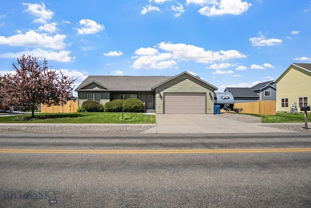 1311 Cruiser Ln, Belgrade, MT 59714 - ranch-style house featuring a garage and concrete driveway