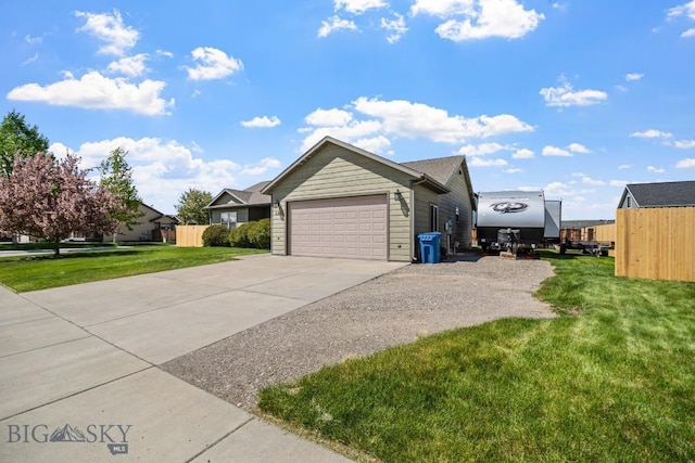 1311 Cruiser Ln, Belgrade, MT 59714 - view of side of home with concrete driveway and a garage