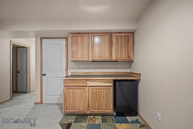 1311 Cruiser Ln, Belgrade, MT 59714 - kitchen featuring baseboards and light countertops