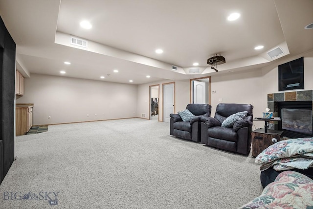 1311 Cruiser Ln, Belgrade, MT 59714 - cinema room with a tiled fireplace, carpet, and recessed lighting