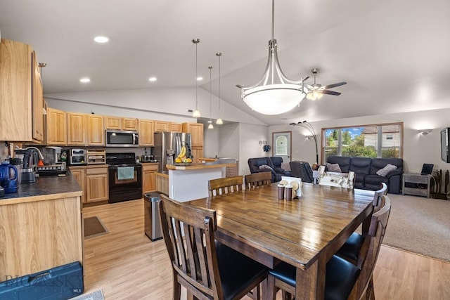 1311 Cruiser Ln, Belgrade, MT 59714 - dining space with lofted ceiling, light wood-style floors, a ceiling fan, and recessed lighting