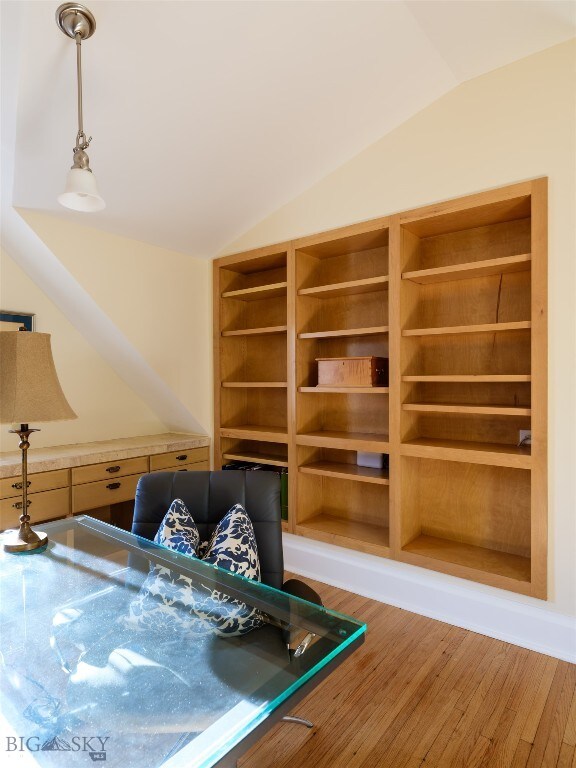 rec room featuring hardwood / wood-style floors and lofted ceiling